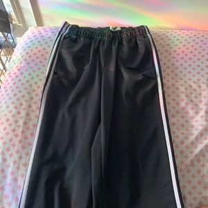 Heavily used Adidas track pants